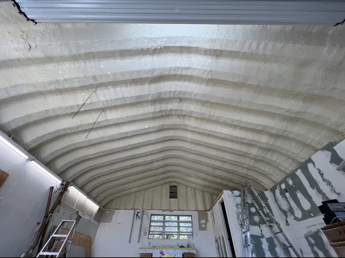 Spray polyurethane foam applied to the underside of a metal roof deck in Moses Lake